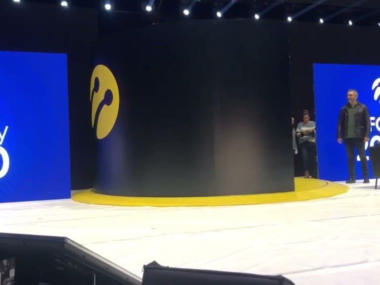 Turkcell event — on stage, in the brand's own colour