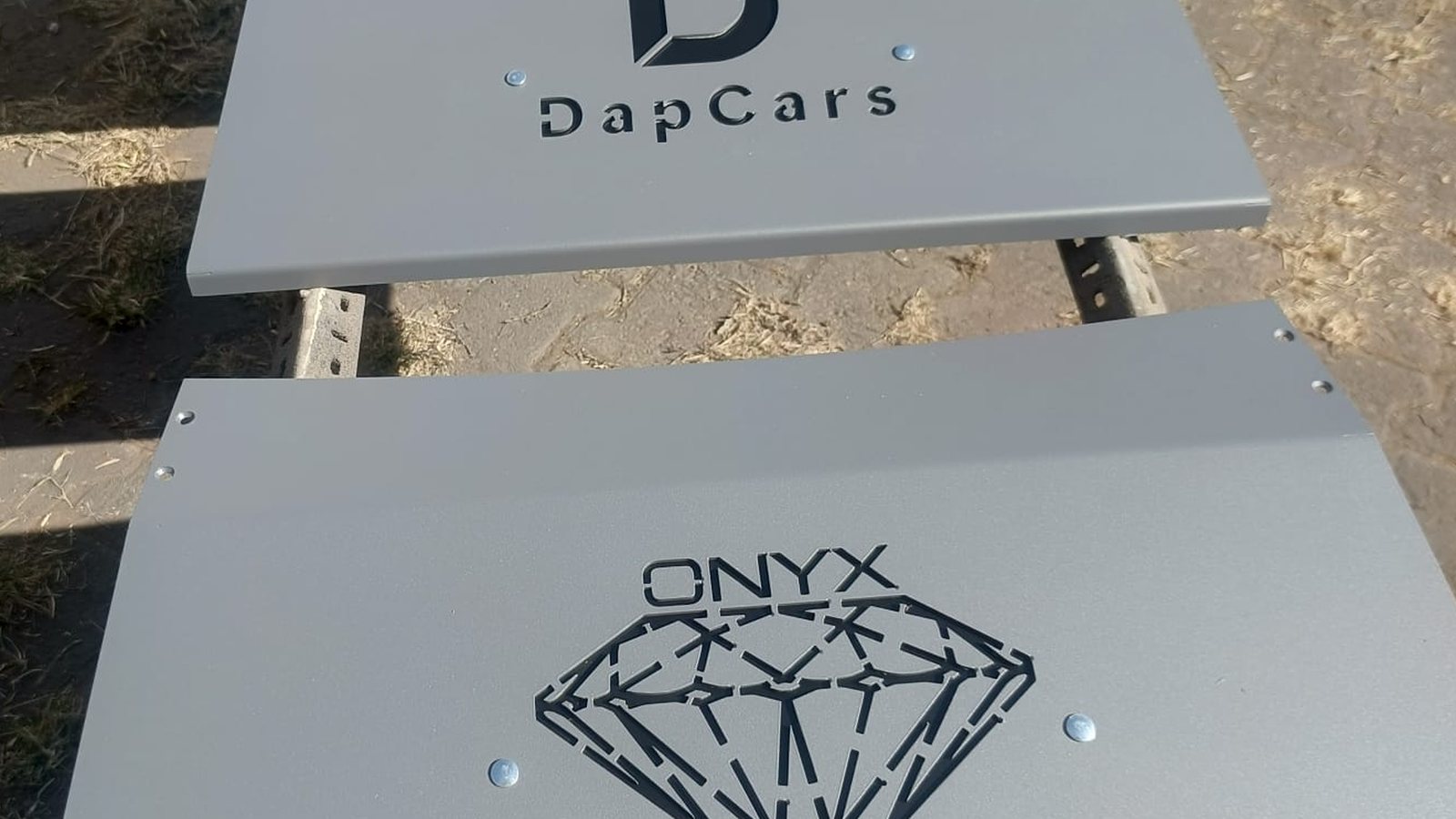 Ramps cut with the customer's own logo — DapCars and ONYX, before dispatch